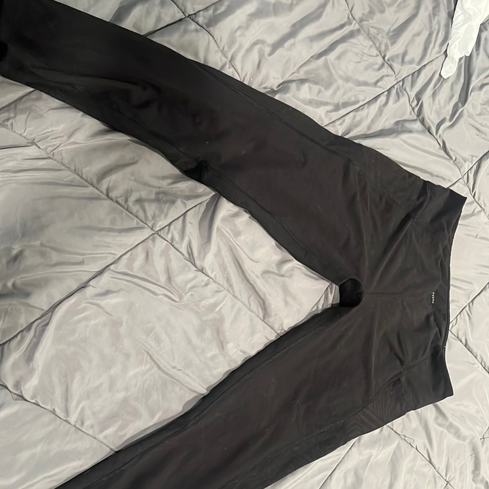 Z by Zobha black leggings with design on the size as well as zipper on both legs